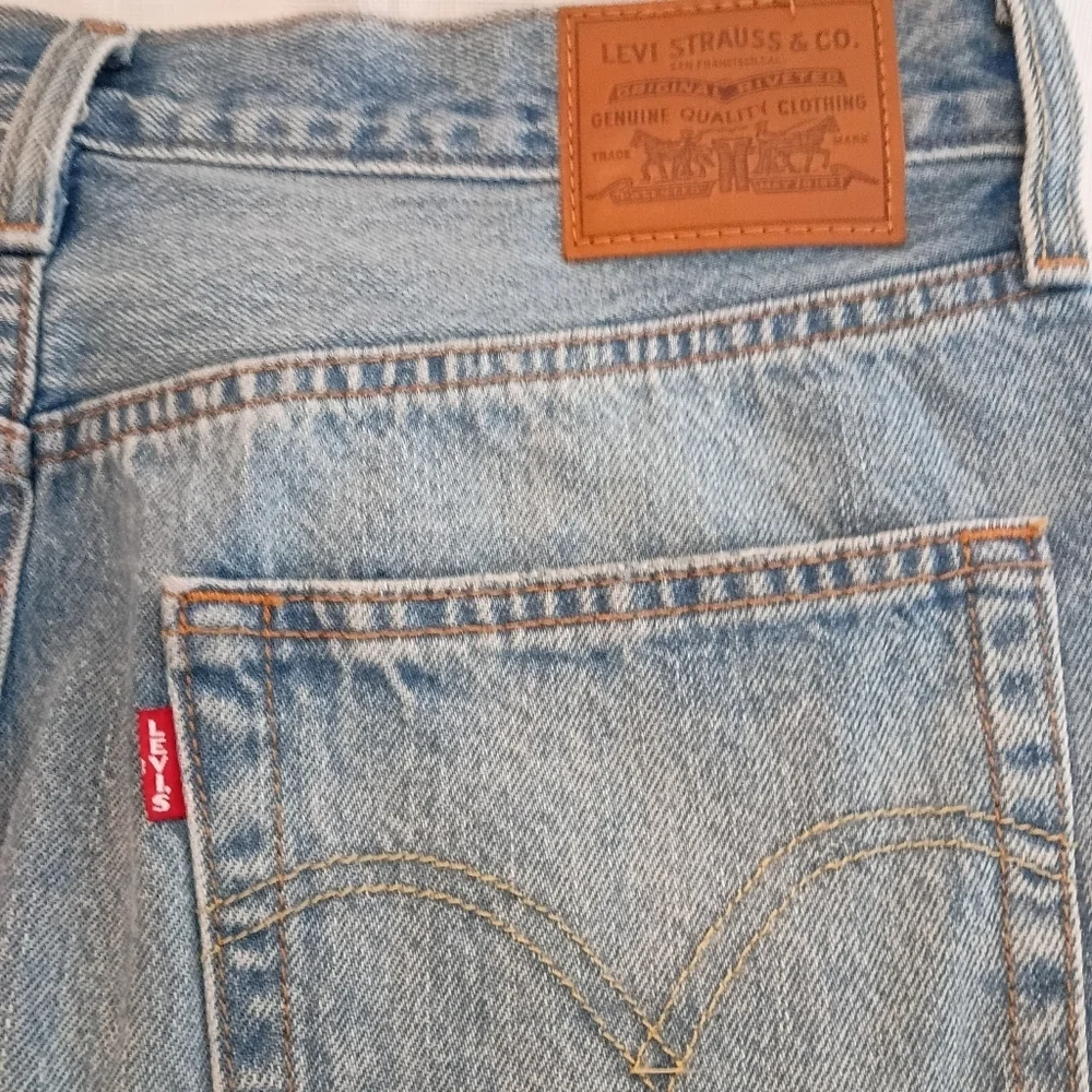 Levi’s Premium High Waisted Denim Mini Skirt Blue Light Wash Distressed Size 30
